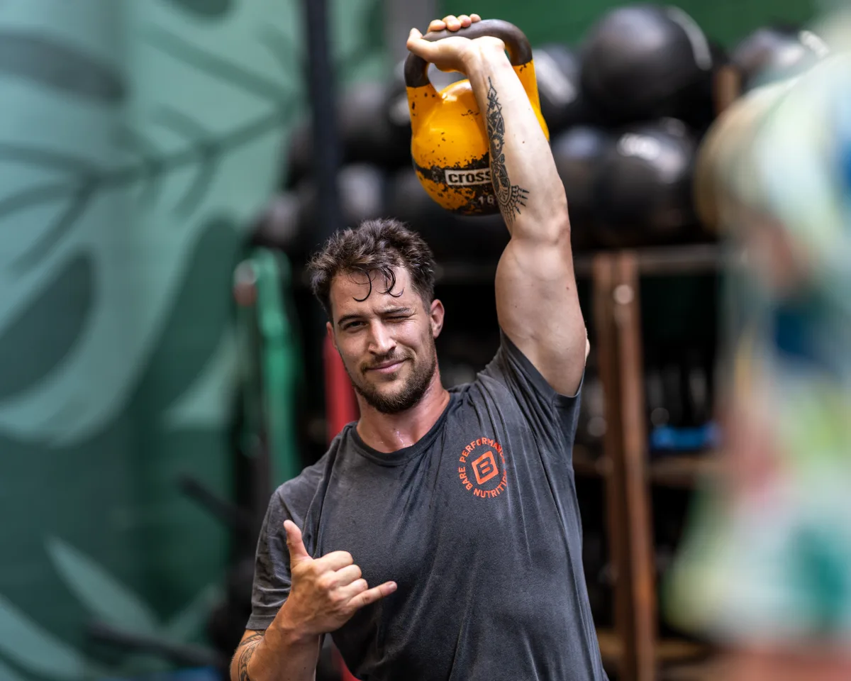 Athlete training with a kettlebell at WE.FIT